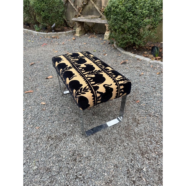 A chrome steel mid-century modern bench in the style of Milo Baughman and attributed to Tri-Mark. Newly upholstered in...