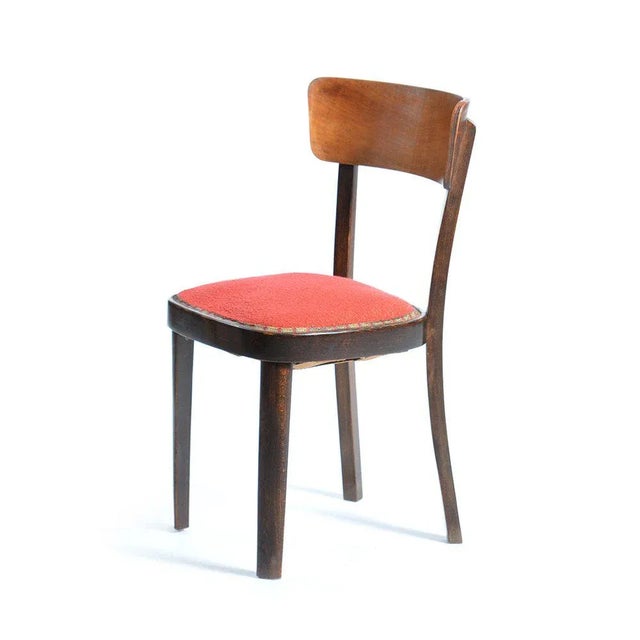 Strong wooden chair dates back to the 1950s. Very good, original condition. Made of oak wood with an upholstered spring...