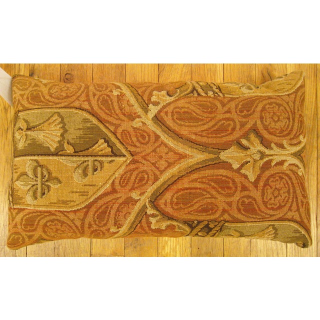 Antique Jacquard Tapestry Pillow; size 1'0” x 1'8” An antique decorative pillow with a symmetrical design allover a gold...