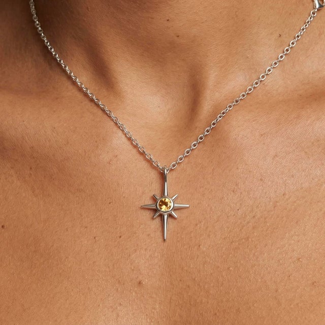 Graceful and radiant, this celestial-inspired pendant features a luminous Citrine gemstone, set at the heart of a delicate...