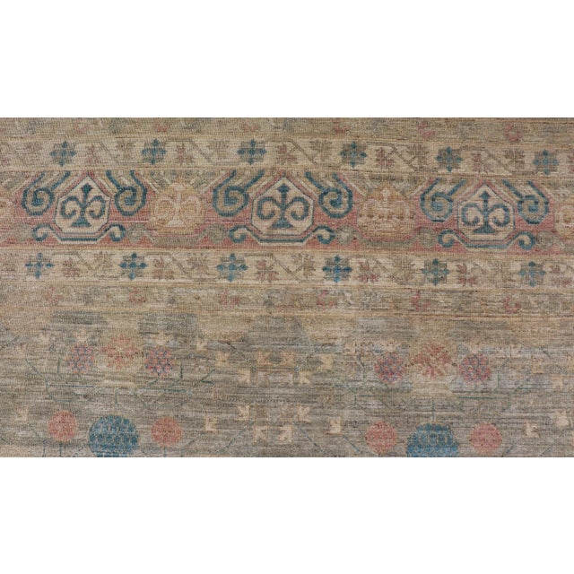 Textile Large Modern Tribal Khotan Rug in Shades of Cream Green Blue and Coral For Sale - Image 7 of 12