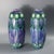 Pair of Minton Secessionist No.1 vases of stretched barrel-like forms. The purple ground is decorated in blue and white...