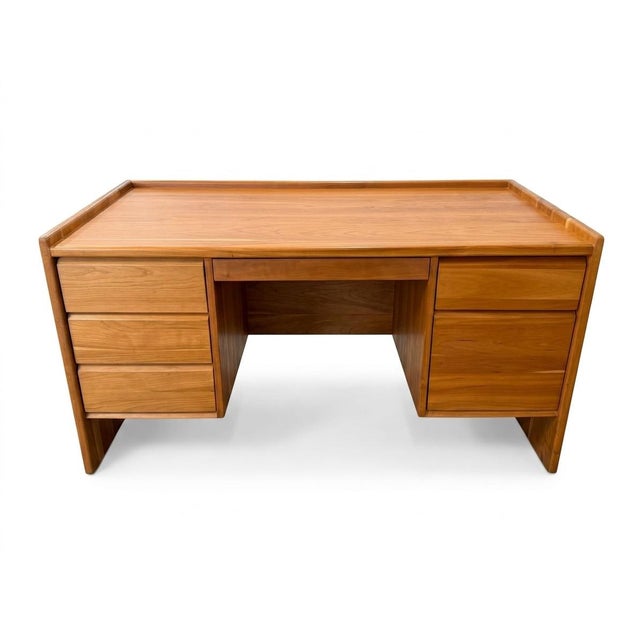 Handcrafted by Pompanoosuc Mills, this substantial solid cherry desk offers the clean lines and warm natural grain that...