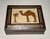 Charming vintage marquetry box with detailed inlay and mother-of-pearl. Features camel and palm tree. Measures 4 1/4” x 5...