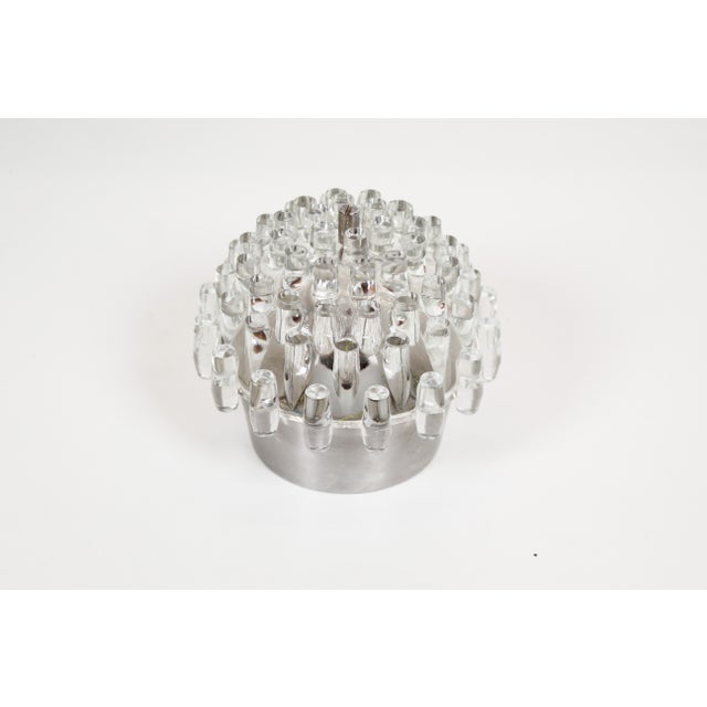 Playful 70s 'space age' wall lamps produced in France, combining aluminum frames with glass shades. The lamps are in good...