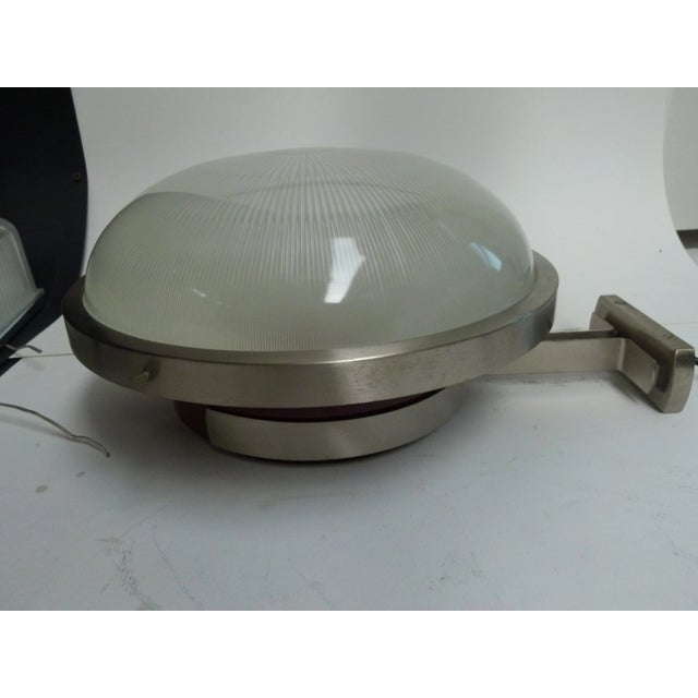 This wall light features its original paint with a white and Bordeaux red interior. There are three bulbs, and the glass...