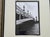 This set of four black and white Parisian photographs beautifully framed in heavy black and gilt wooden frames depicting...