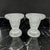 A pair of vintage clear pressed glass candle holders. Featuring a striking fluted, ribbed design with a wide flared rim...