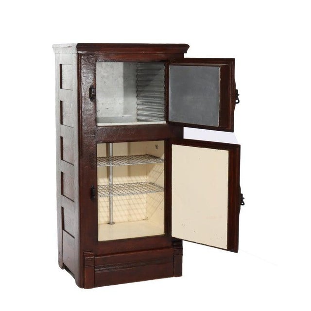 Antique Oak Raised Panel Ice Box C1900 Measures - 49 1/2" x 24 3/8" x 17 1/2" This antique oak ice box, dating from around...