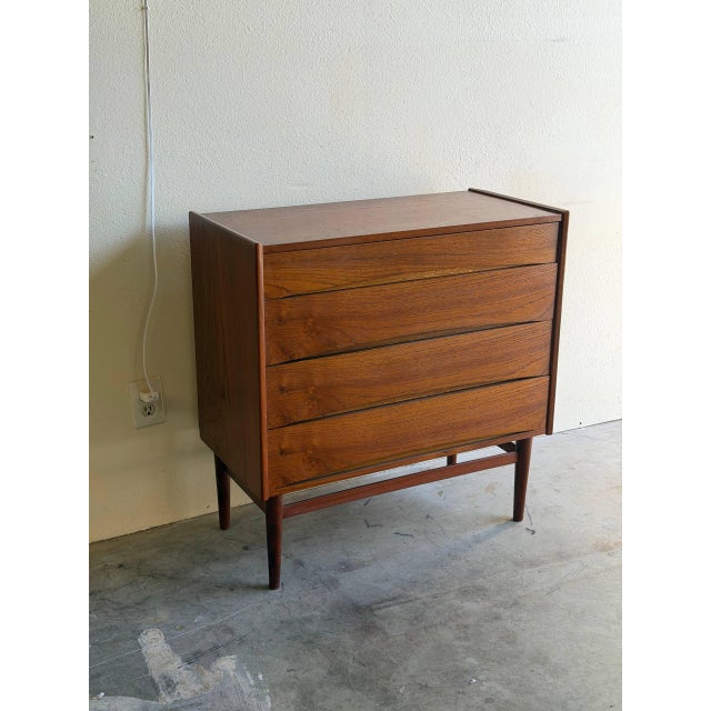 Danish teak chest of drawers dating to the 1960s, designed in the clean, architectural Mid-Century Modern style of Arne...