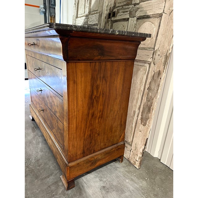 A beautiful louis-philippe commode, 19th century, crafted from solid walnut and walnut veneer, featuring a striking burr...