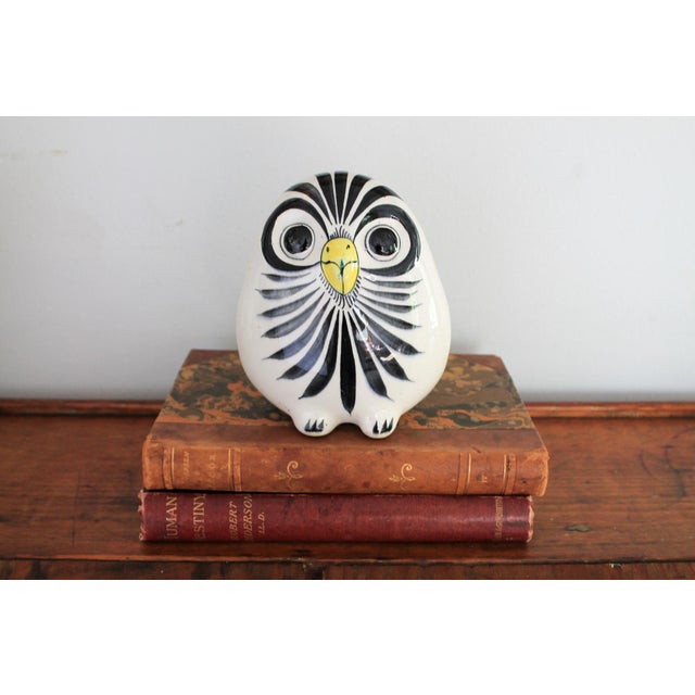 Vintage hand painted ceramic owl with floral motif on backside. Signed by artist. Minor age wear. No chips or cracks.