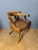 Restoration period office chair with curved arms. Slightly scratched brown vinyl seat. Seat height 48cm