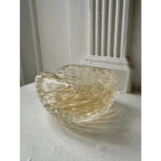 Beautiful vintage gold fleck ashtray or catch all. Thick, heavy glass. No flaws.