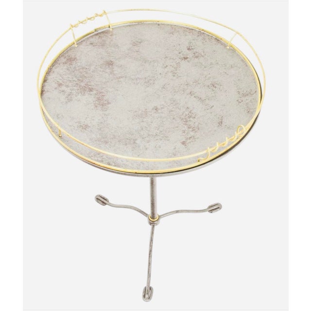 Late 20th / Early 21st Century | Continental Style A wonderfully chic round silvered-metal tray table combining a...