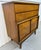 This listing is for a Mid-Century Modern United Diamond Walnut High Chest. Featuring a straight line design, two wide...