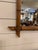 This is a French antique faux-bamboo wall mirror with a hand-carved wood frame. The frame is wood that has been shaped and...