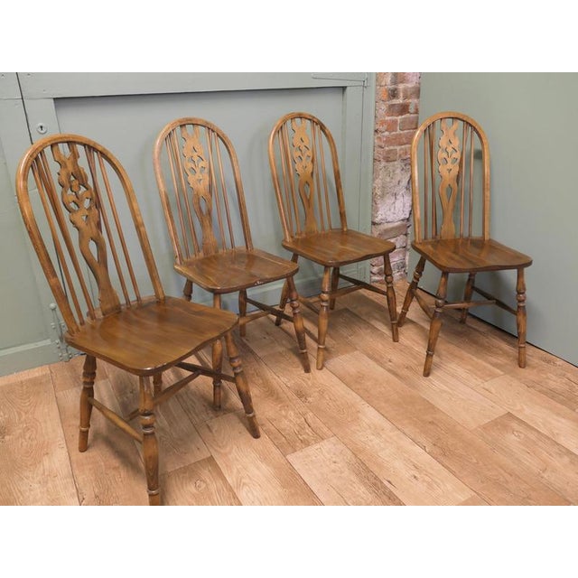Set of 4 Country Kitchen Dining Chairs, Wheel Back The chairs are a classic high back design and hand made in solid wood...