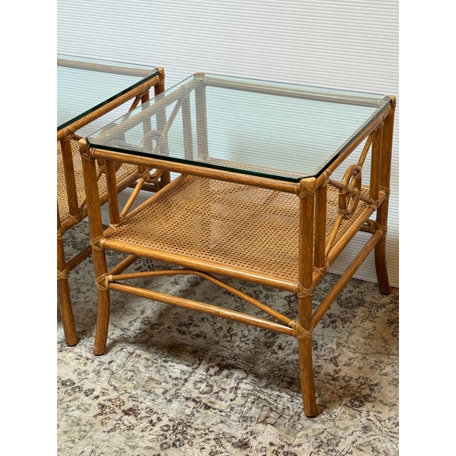 Design Plus Gallery presents a Pair of Target Design McGuire Side Tables. The tables feature a rattan frame with McGuires...