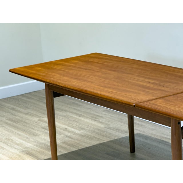 Wood Mid-Century Modern Danish Teak Extending Dining Table by Johannes Andersen for Heals, 1960s For Sale - Image 7 of 17