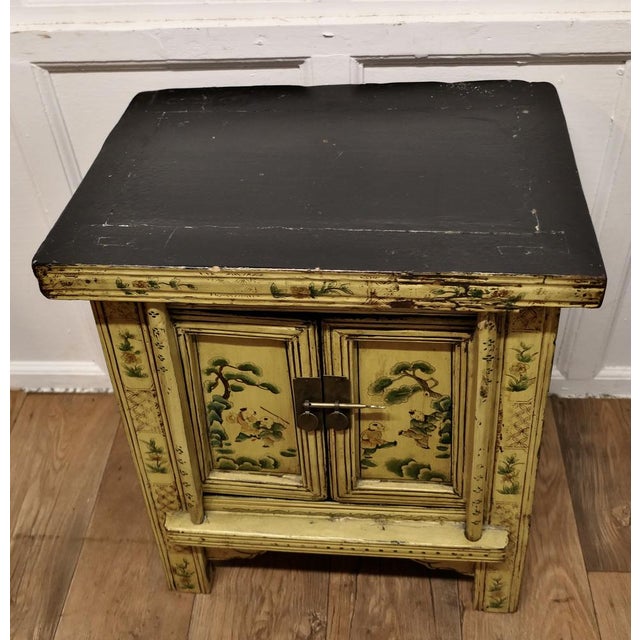 A Superb Cream Lacquered Chinoiserie Decorated Cabinet A Prime example of chinoiserie decor with traditional Chinese...