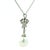 The platinum design is beautifully detailed with graceful ribbon and foliate motifs, set throughout with approximately...