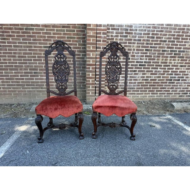 Pair of Antique Anglo-Dutch 19th Century Walnut Carved High Back Hall Chairs They feature high-backs carved frames with...