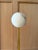 A striking pair of Pedra LED wall sconces by Visual Comfort Signature, featuring sculptural natural alabaster set against...