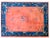 This hand-woven Chinese Art Deco rug from the 1920s features a vibrant coral field adorned with traditional floral sprays...