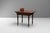Double sided Victorian walnut side table with inset leather top on turned legs with original casters. Circa 1880.