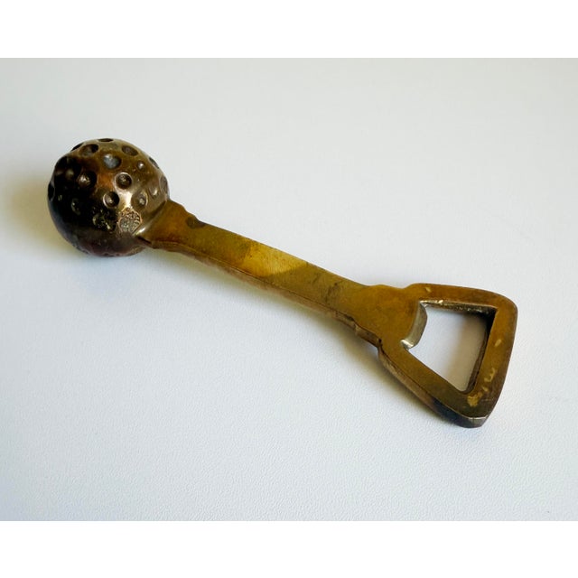 Vintage 1970s brass golf ball bottle opener with nice weight in hand. Perfect for gifting. Unmarked.