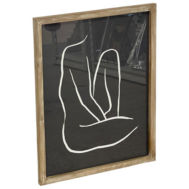 Framed minimalist abstract artwork featuring a continuous white line figure against a solid black background. The...