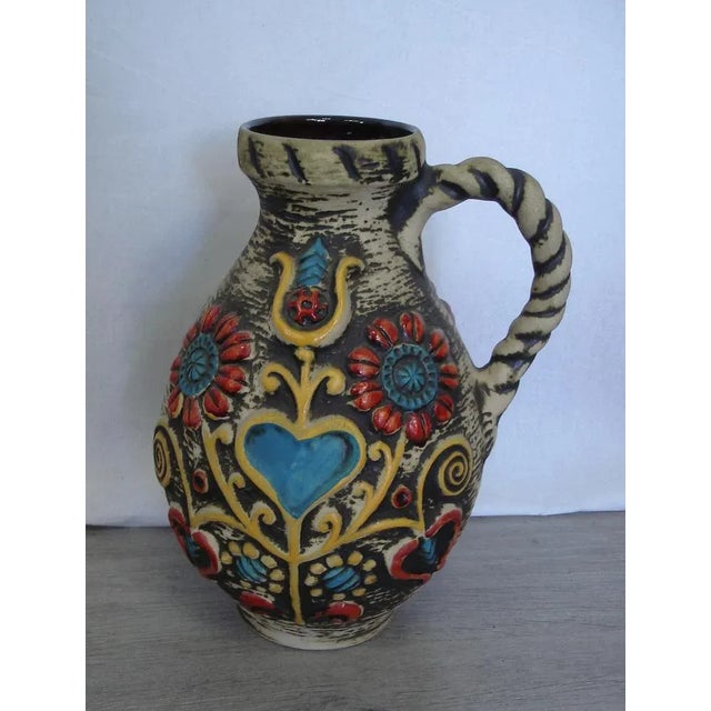 This pitcher from Bay Keramik is so kitschy that it looks beautiful again with its floral pattern and pattern and hearts,...