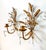 Stunning pair of mid 20th century Italian gilt tole wall sconces, each adorned with cascading faceted crystal prisms....