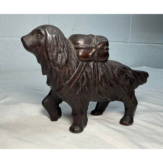 This exquisite antique early 1900's cast Iron saint bernard dog with pack still bank by A.C. Williams is a unique and...