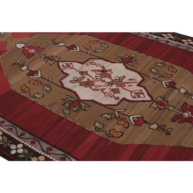 While the medallion design is the visual focal point of this hand-made vintage Turkish kilim rug, the bright gold...
