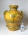 A large and brightly glazed earthenware two handled vessel. This jug is hand thrown pottery earthenware with handles in an...