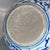 Add a piece of classic Asian artistry to your home with this striking blue and white porcelain jar. The vessel features a...
