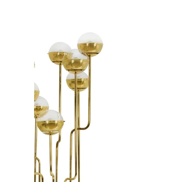 Floor lamp in gold-plated brass with black marble base Custom sizes, materials and finishes. Estimated production time:...