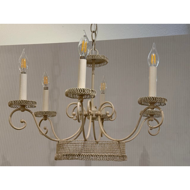 Design Plus Gallery present the Epergne Chandelier from Lamplight Designs. The light fixture is made of metal with a light...