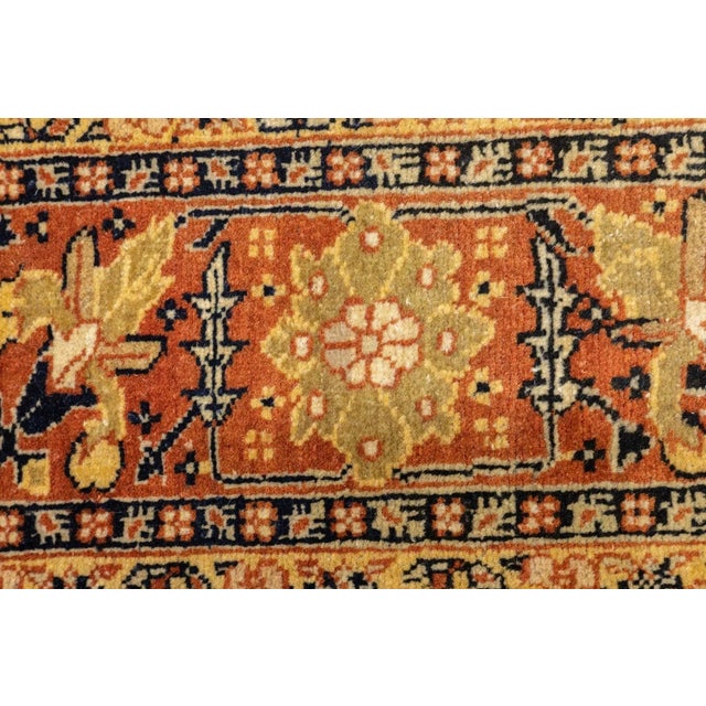 Sand-straw and red, with identically scaled Herati designs, set the palette of this finely woven NW Persian urban scatter....