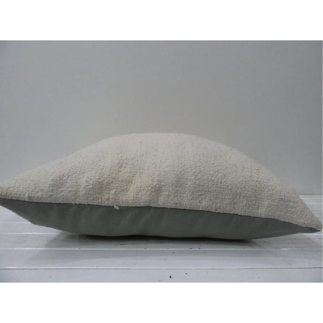 This is a pillow cover made from a vintage kilim rug. The piece was properly washed and ready to use. Pillow inserts not...