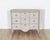 This Gustavian-style chest of drawers is a refined example of Swedish neoclassical design, crafted in pine and finished in...
