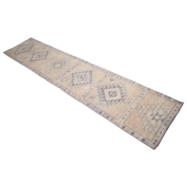 Crafted in the 1960s, this authentic Eastern Anatolian runner rug was originally woven by villagers for personal domestic...