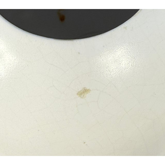 This minimalist set of two ceramic vases was created in the 1960s based on a design by Jan Bontjes van Beek and produced...