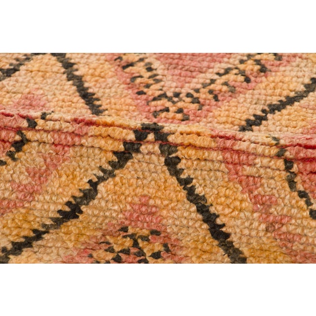 Hand-knotted in wool and originating circa 1950-1959, this 6x12 vintage Moroccan berber runner joins Rug & Kilim’s...