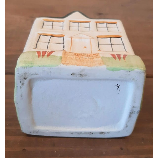 Super cute house cottage bank. This is hand painted and is ceramic porcelain. No flaws. No makers mark. Sweet little...