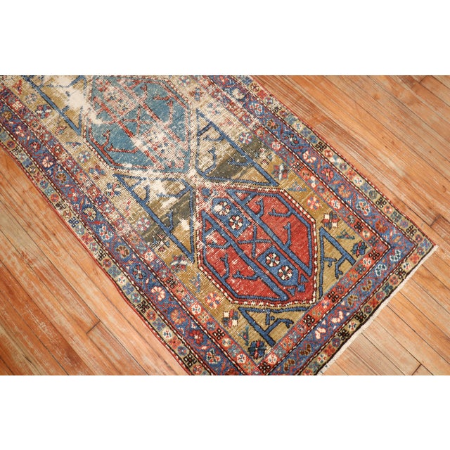 an early 20th -century Worn Persian Runner Measure: 2'9'' x 10'7''.