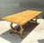A timeless expression of rustic craftsmanship, this vintage farmhouse dining table is distinguished by its elegant lyre-...