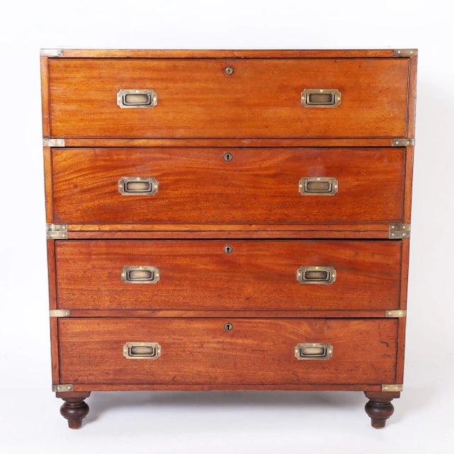 Handsome 19th century campaign chest secretary handcrafted in mahogany in a two-piece construction featuring a pull-out...